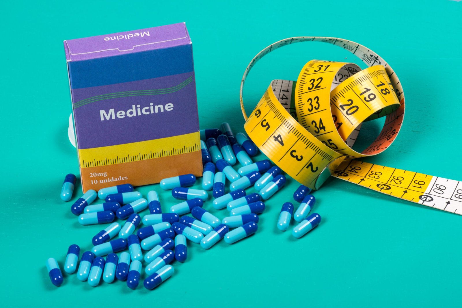 medicine-box-with-some-blue-capsule-and-measuring